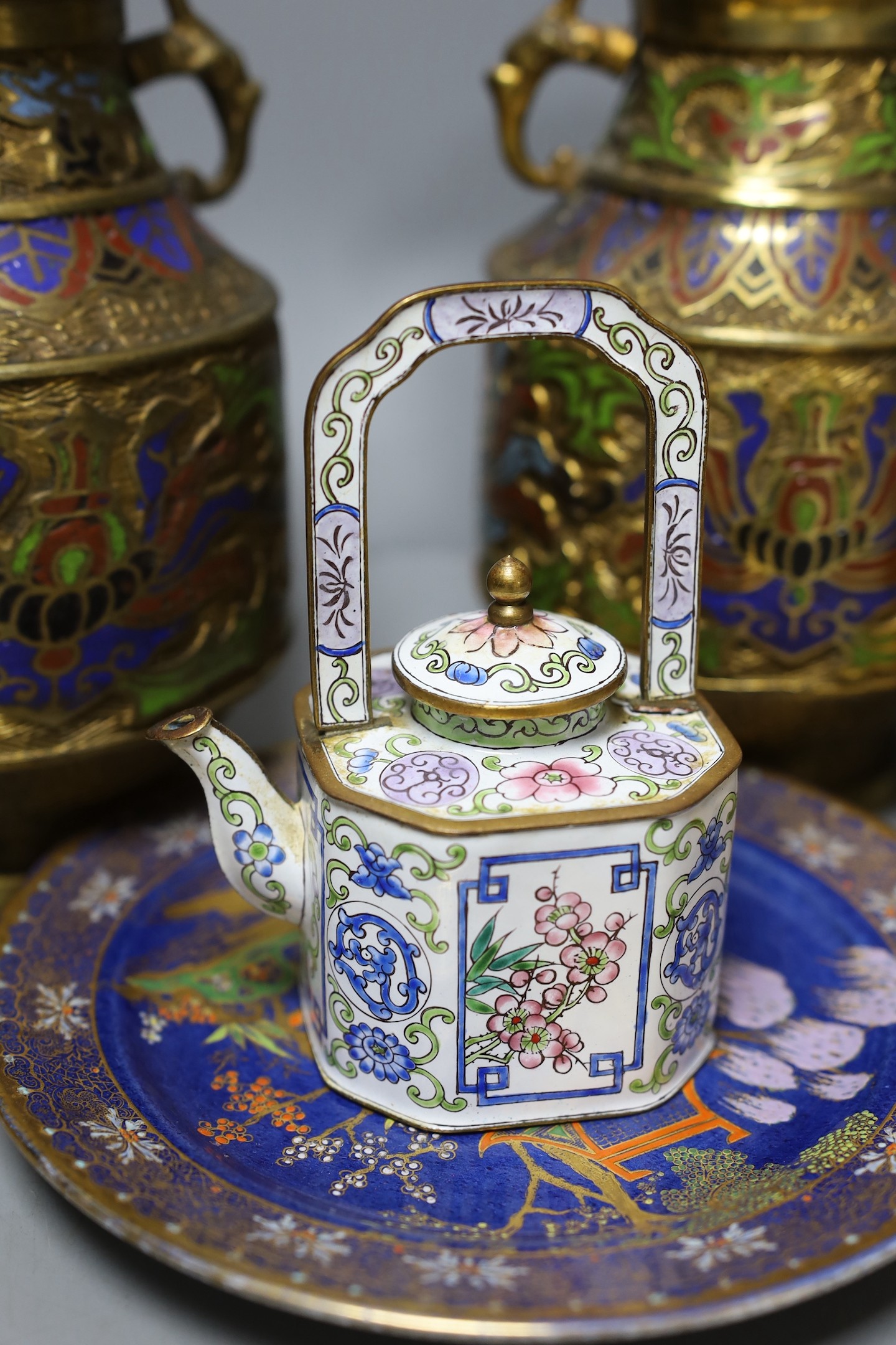 A pair of Japanese champleve enamel vases, a Canton enamel teapot, a jade archers thumb ring (6)